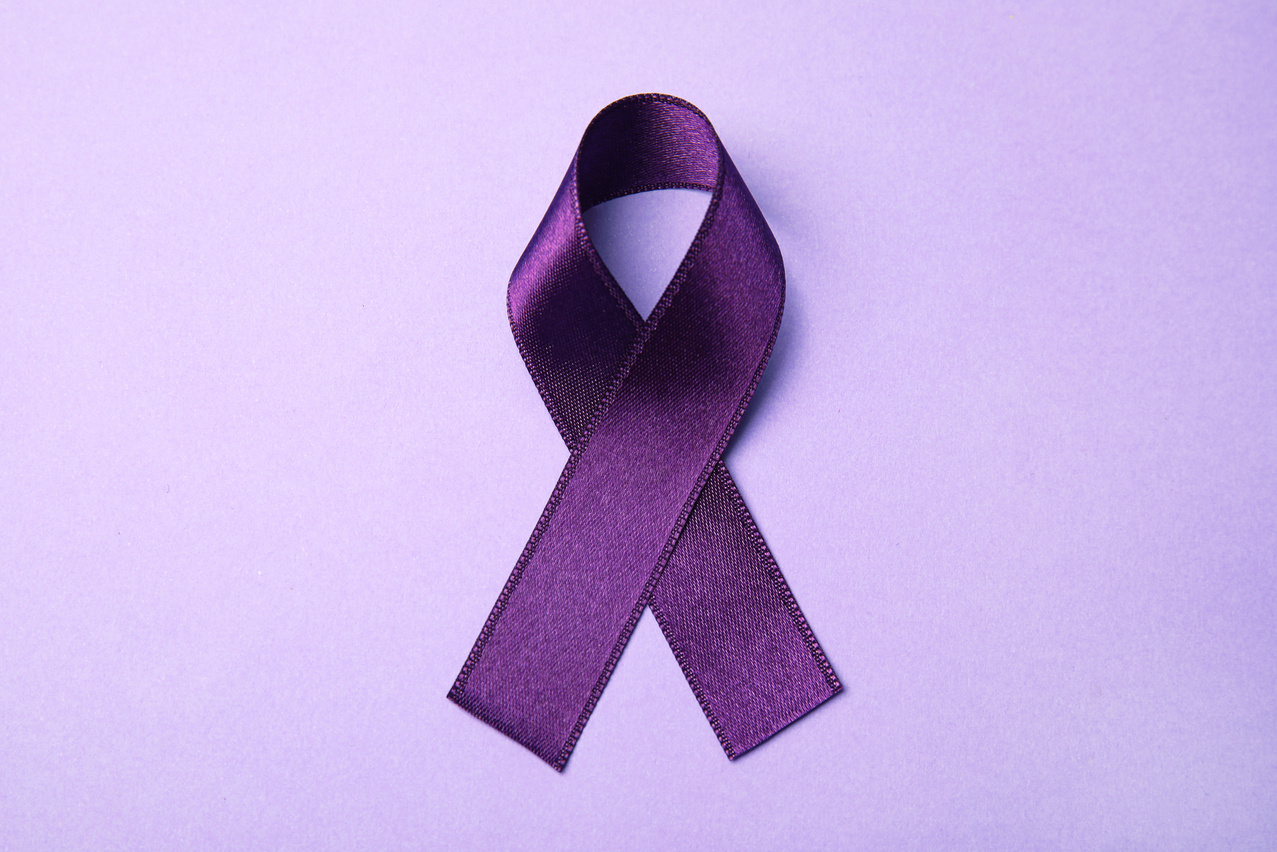 Purple Ribbon on Lilac Background, Top View. Domestic Violence Awareness